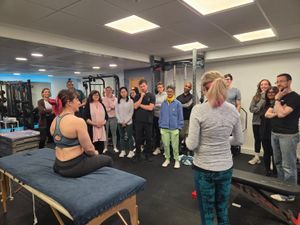 DNS instructor demonstrating assessment technique to group at Elevate LDN studio