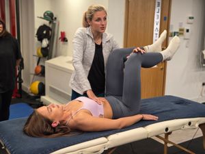 Instructor demonstrating supine assessment technique during DNS Exercise course