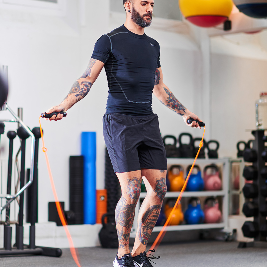 man skipping for cardiovascular fitness in a personal training studio