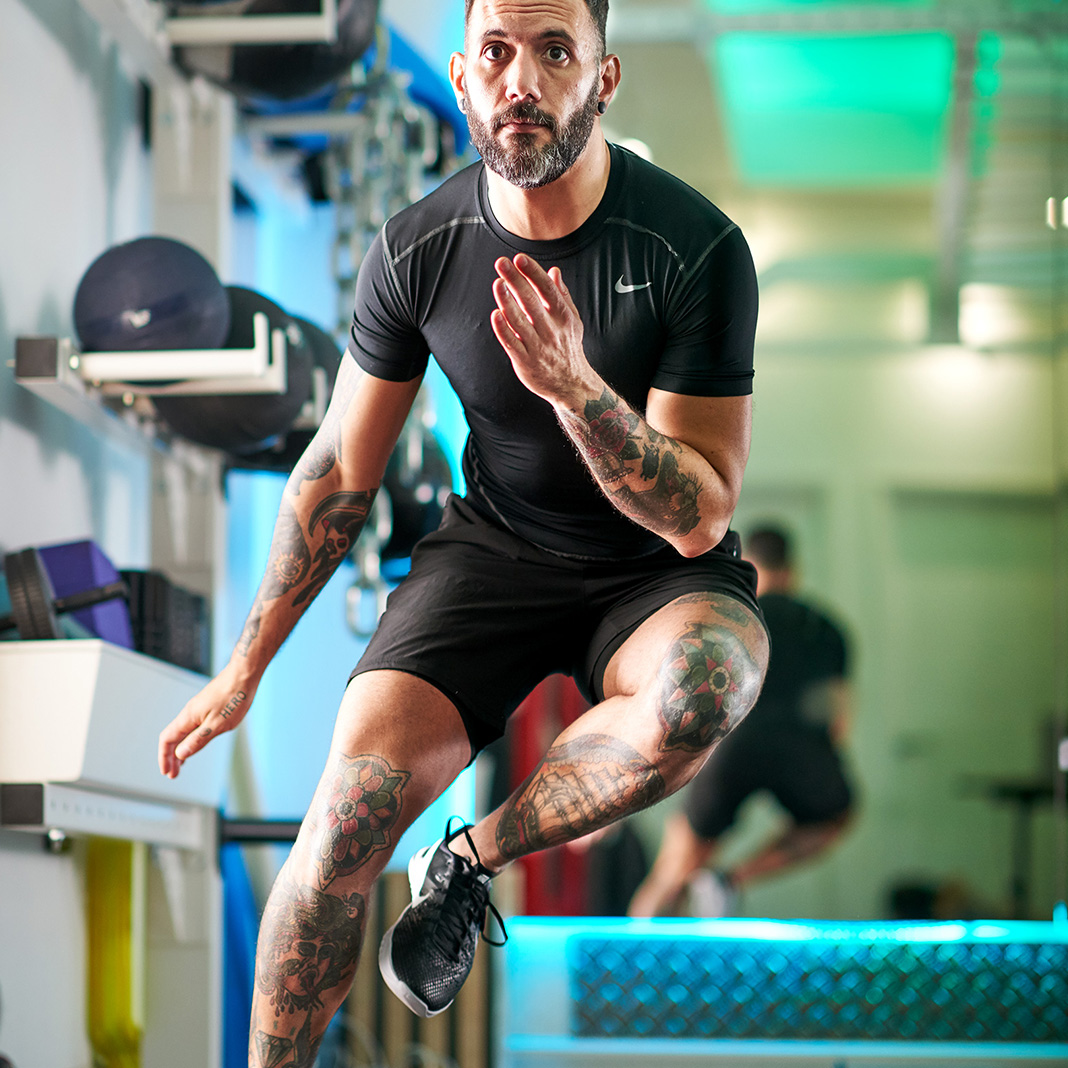 Man doing SAQ exercises in a personal training studio